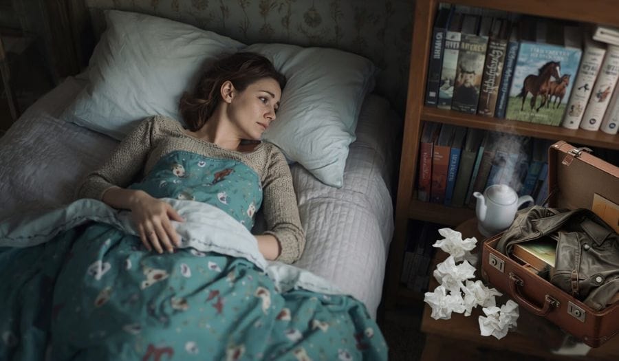 Krank im Bett vor einem gebuchten Kurs oder Event – Unsicherheit wegen Annullationskosten